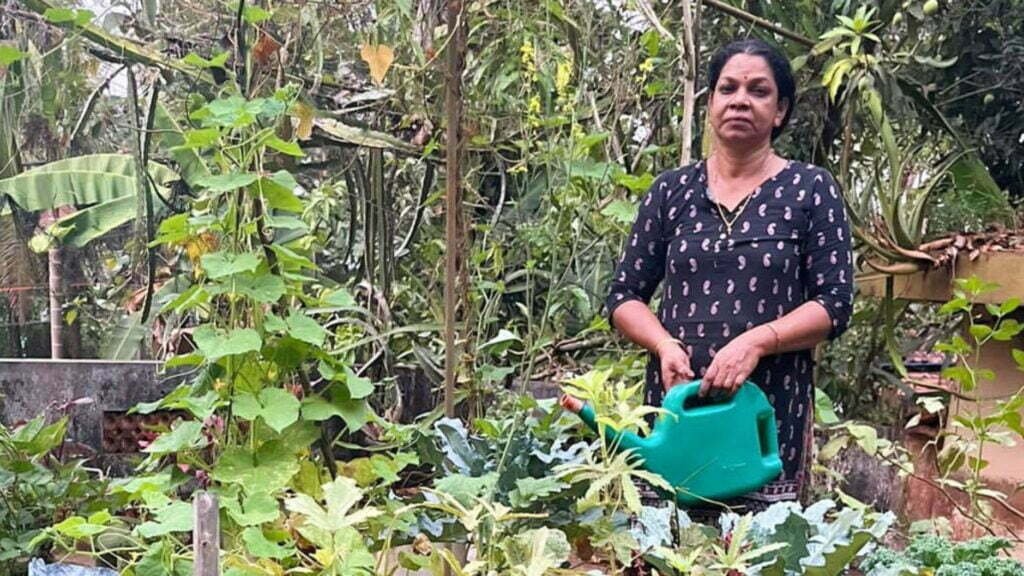 Ambika Baji on the terrace of her house where she cultivates vegetables.