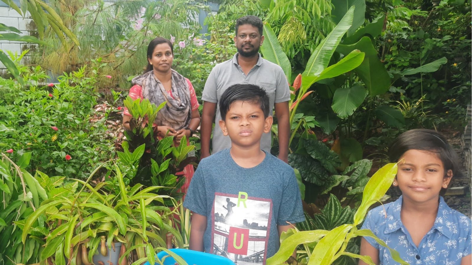Ezekiel Poulose with his wife and children at his farm in Chottanikkara, Kerala
