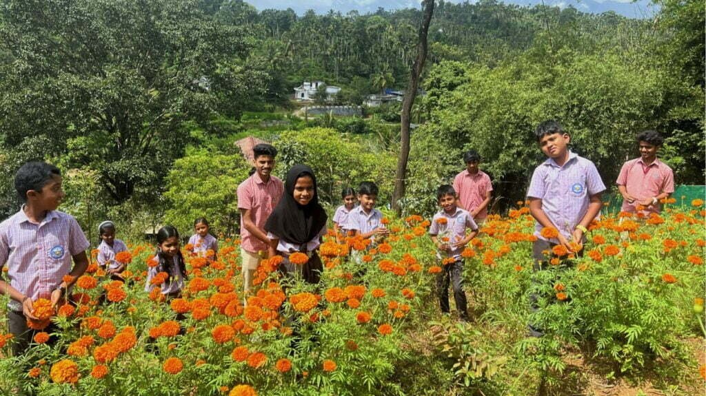 Students at their marigold garden in the premises of their school in Wayanad, Kerala.