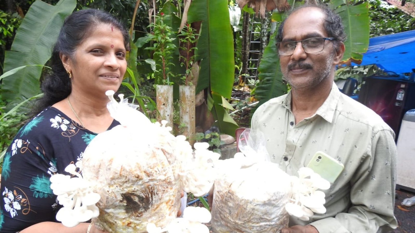 Chithalekha along with her husband Ajayakumar at their mushroom farm in Vengad, Kannur, Kerala.