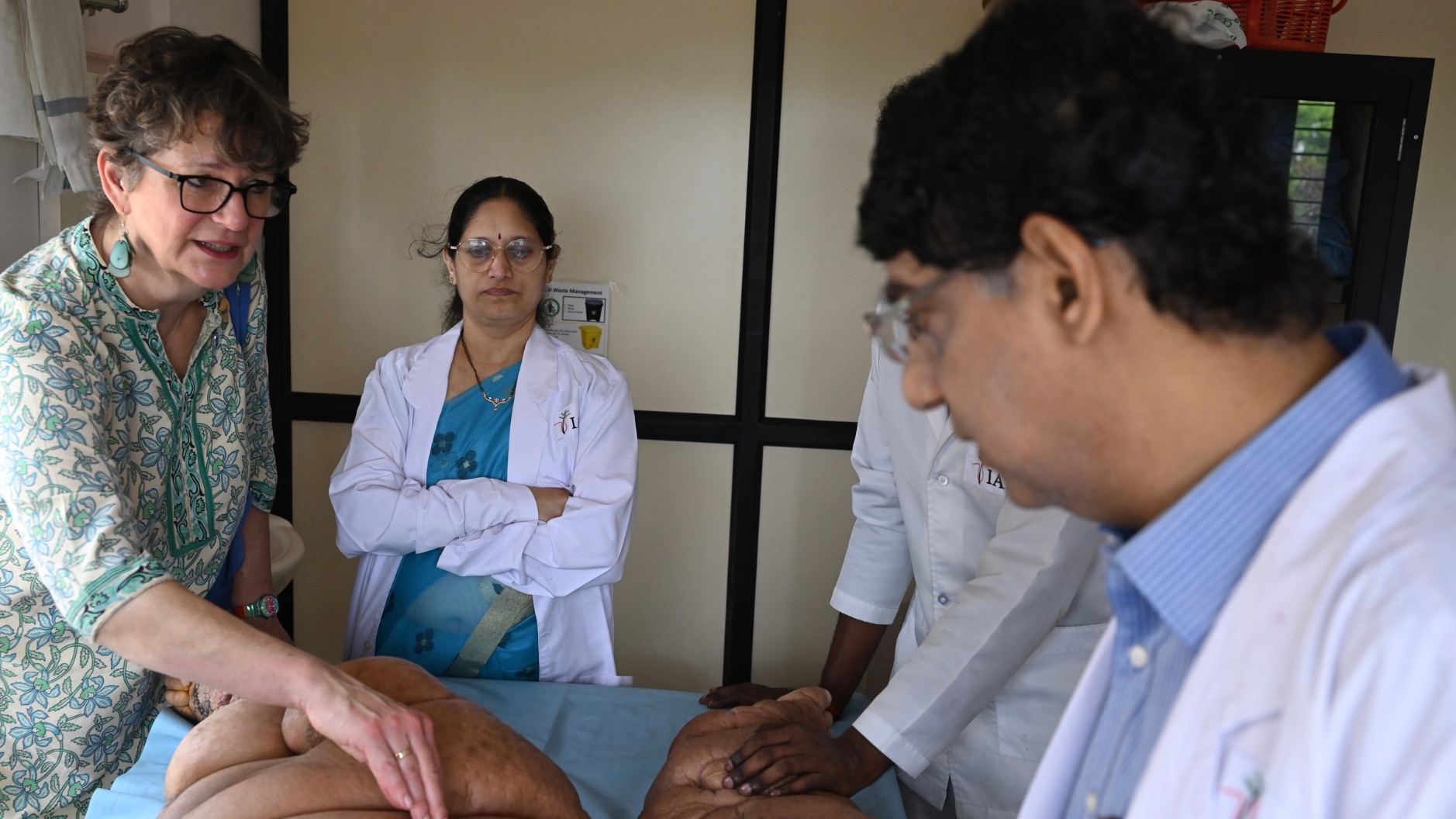 Professor Claire Fuller, Chair of the International Foundation of Dermatology and Consultant Dermatologist in NHS, Westminster, London, UK, and former Chair of the Skin NTD group, World Health Organisation (WHO along with IAD Director Dr S R Narahari and Senior Dermatologist Dr K S Prasanna attending to a patient.